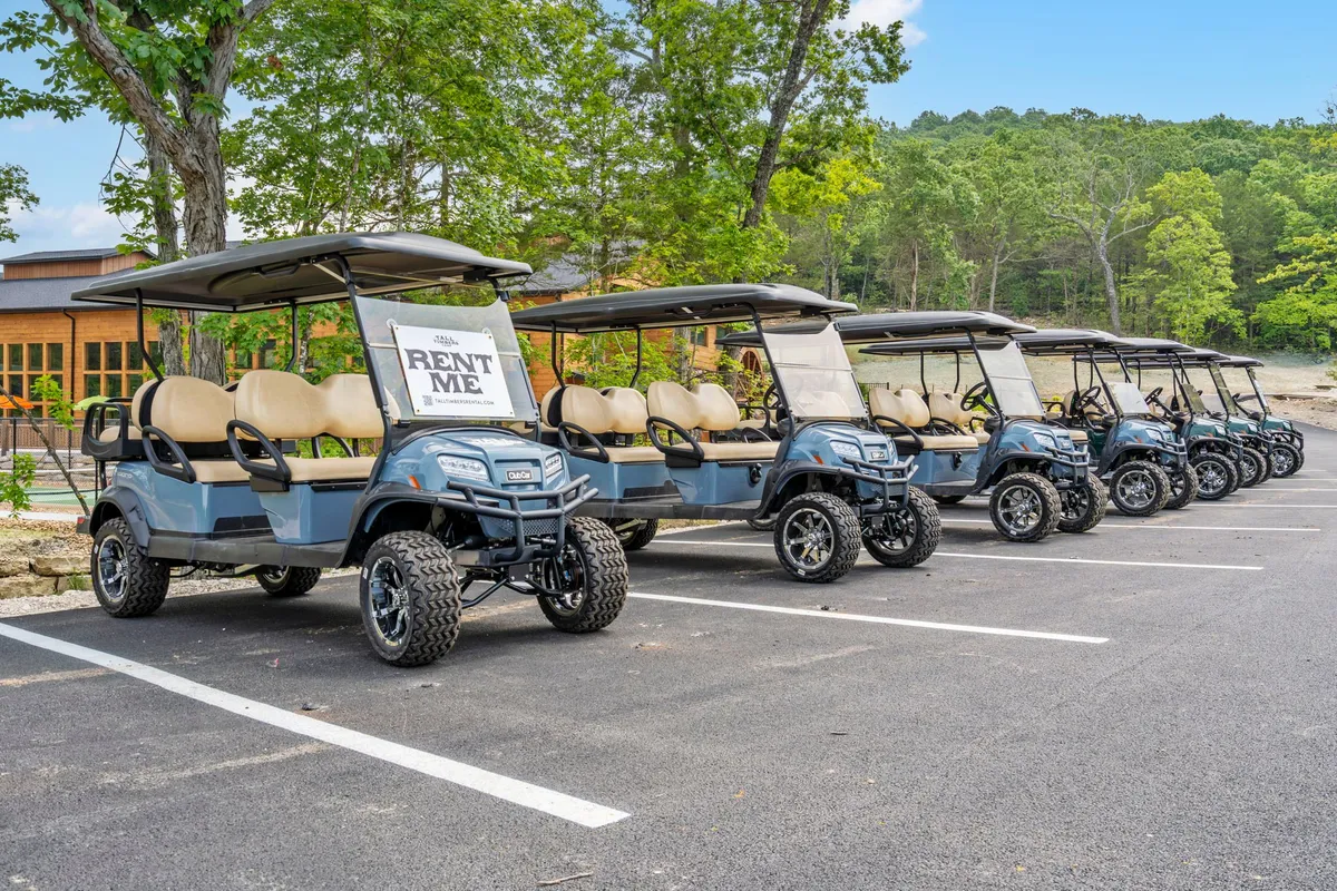 Golf carts with a bold 'RENT ME' sign sit ready amidst lush greenery, inviting guests to explore the freshly developed grounds. The scene suggests ease of access, adventure, and the joy of discovering new spaces within the resort as they continue to evolve.